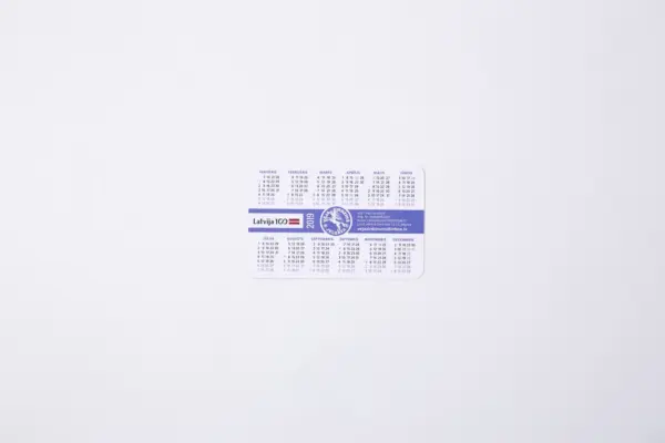 Custom pocket calendar with Latvia 100 and Vēja zirdziņš logos on a white background