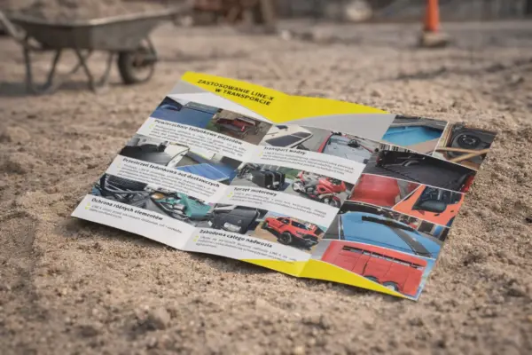 Open booklet on sand as a sample of custom booklet printing
