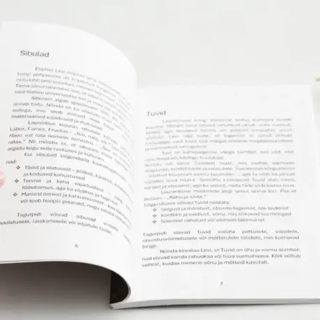 Open soft cover book as a sample of custom book printing