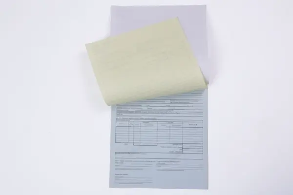 Custom carbonless forms set with raised yellow sheet and gray copy