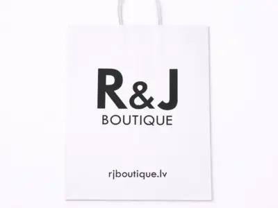 White custom paper bag with black R&J BOUTIQUE print