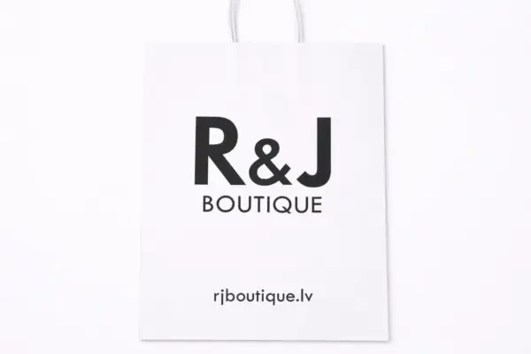 White custom paper bag with black R&J BOUTIQUE print