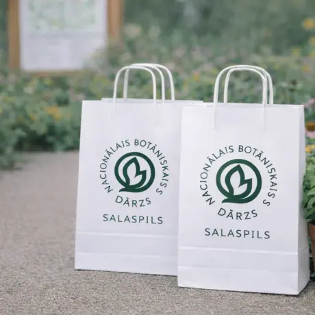 White custom paper bags with print for the National Botanic Garden Salaspils