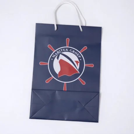 Dark blue custom gift bag with print and cord handles