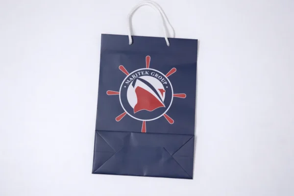 Dark blue custom gift bag with print and cord handles
