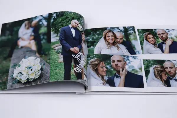 Open custom photo book with high-quality printing and wedding photos of a married couple