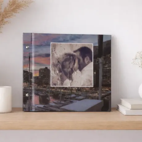 Custom photo book with a couple on the cover, displayed on a wooden shelf