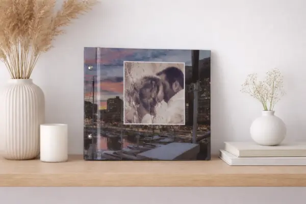 Custom photo book with a couple on the cover, displayed on a wooden shelf