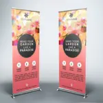 Two custom roll-up stands with bright floral print and aluminum frame