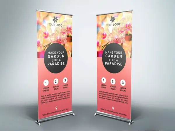 Two custom roll-up stands with bright floral print and aluminum frame