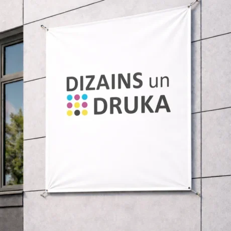 White custom banner printing sample on a building wall with the text Design and Print
