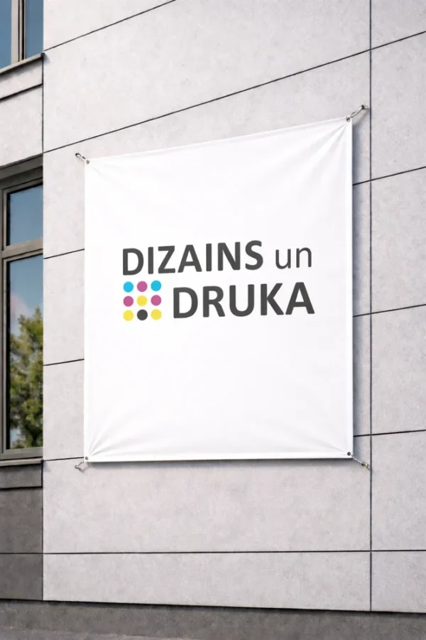 White custom banner printing sample on a building wall with the text Design and Print